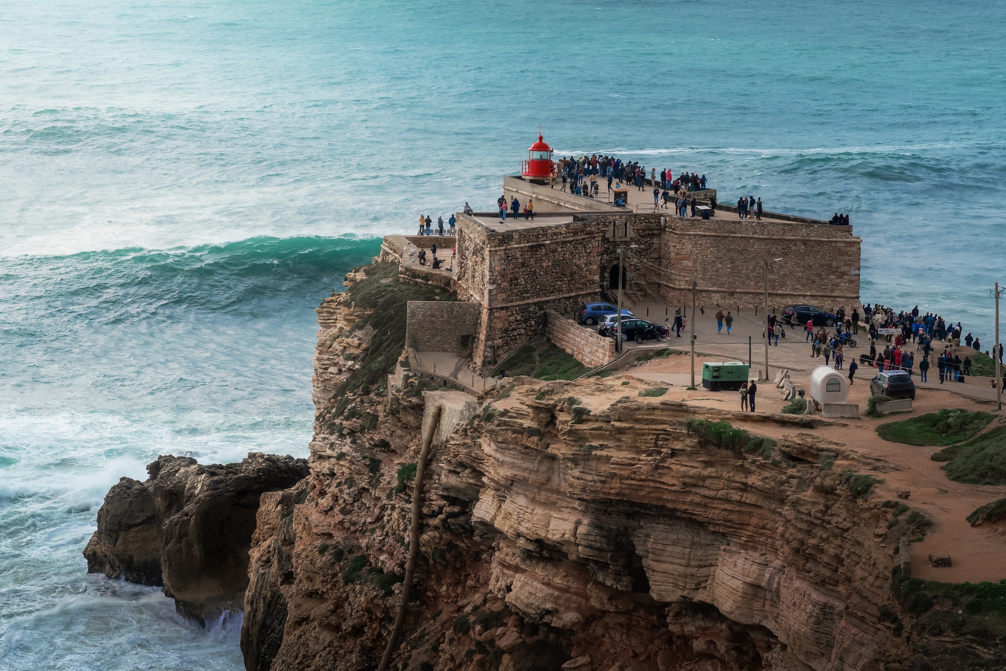 Big Waves of Nazare at Fort of Sao Miguel Arcanjo Lightouse - Nazare, Portugal