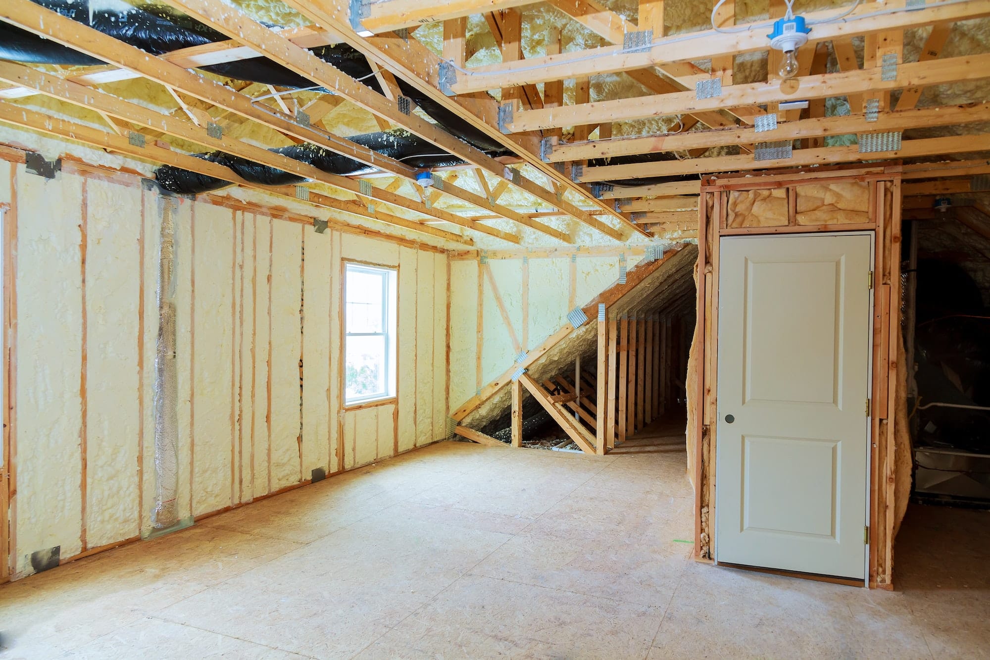 Heat isolation in a new prefabricated house with mineral wool and wood.