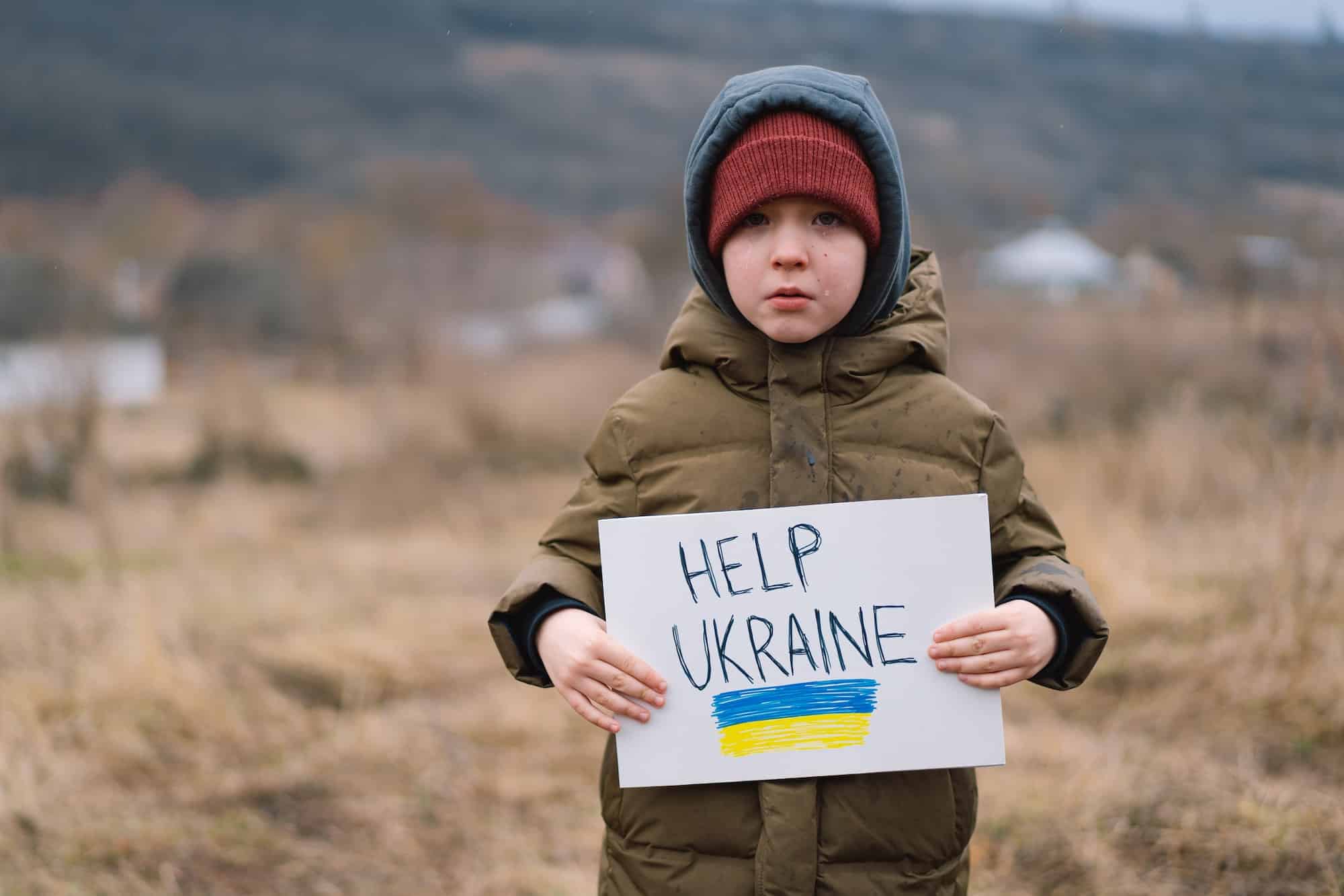 Help Ukraine. War of Russia against Ukraine. Ukrainian Crying boy asks to stop the war in Ukraine.