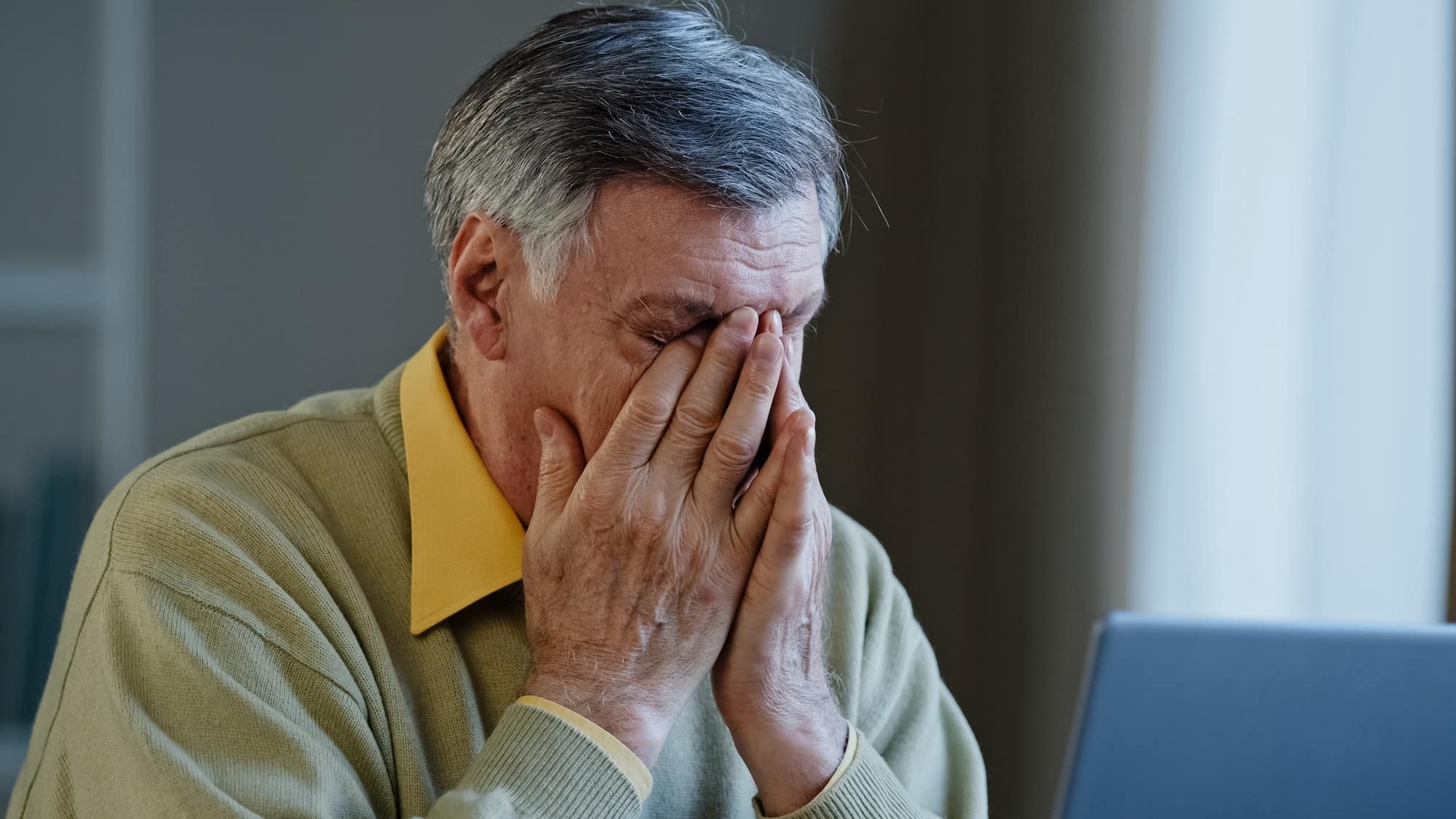 Senior mature older businessman looking laptop nervous work stress problems losing failure at home