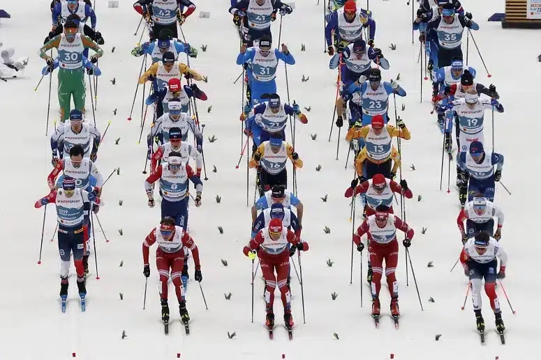 Skiers depart for the 2x15km Skiathlon event at the Nordic World Ski Championships. (Photo by Odd ANDERSEN / AFP) AFP or licensors