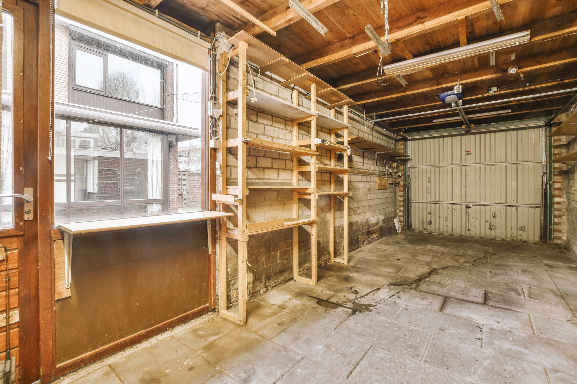 Spacious garage with brick walls