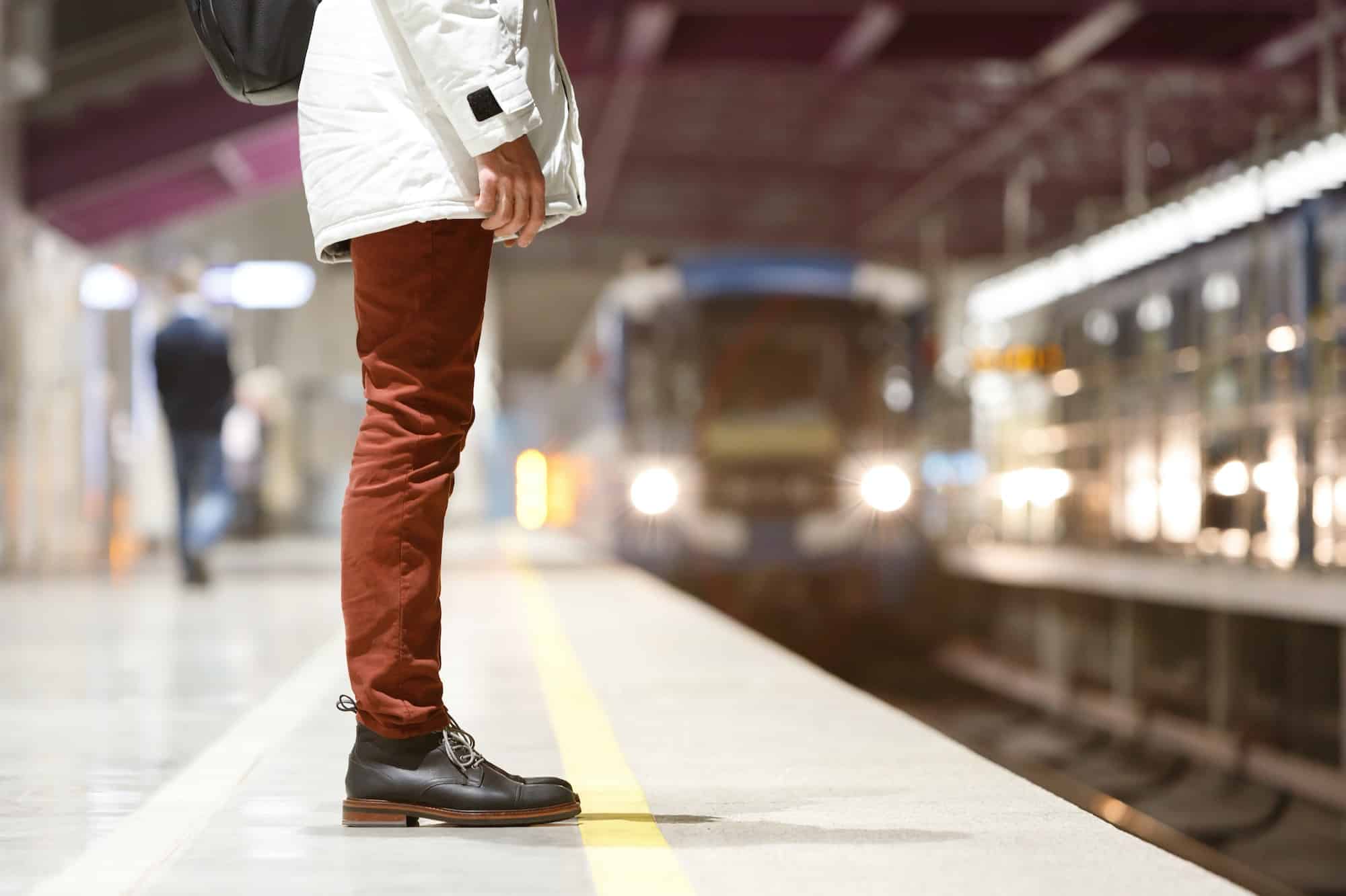 man waiting train at metro station