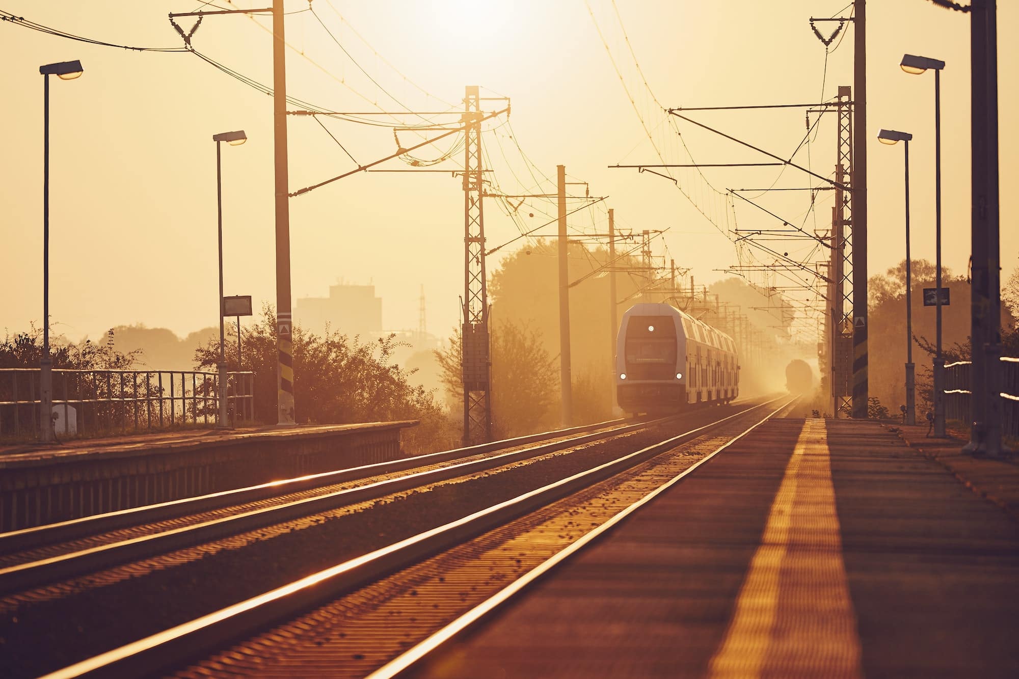 Passenger train at sunrise.