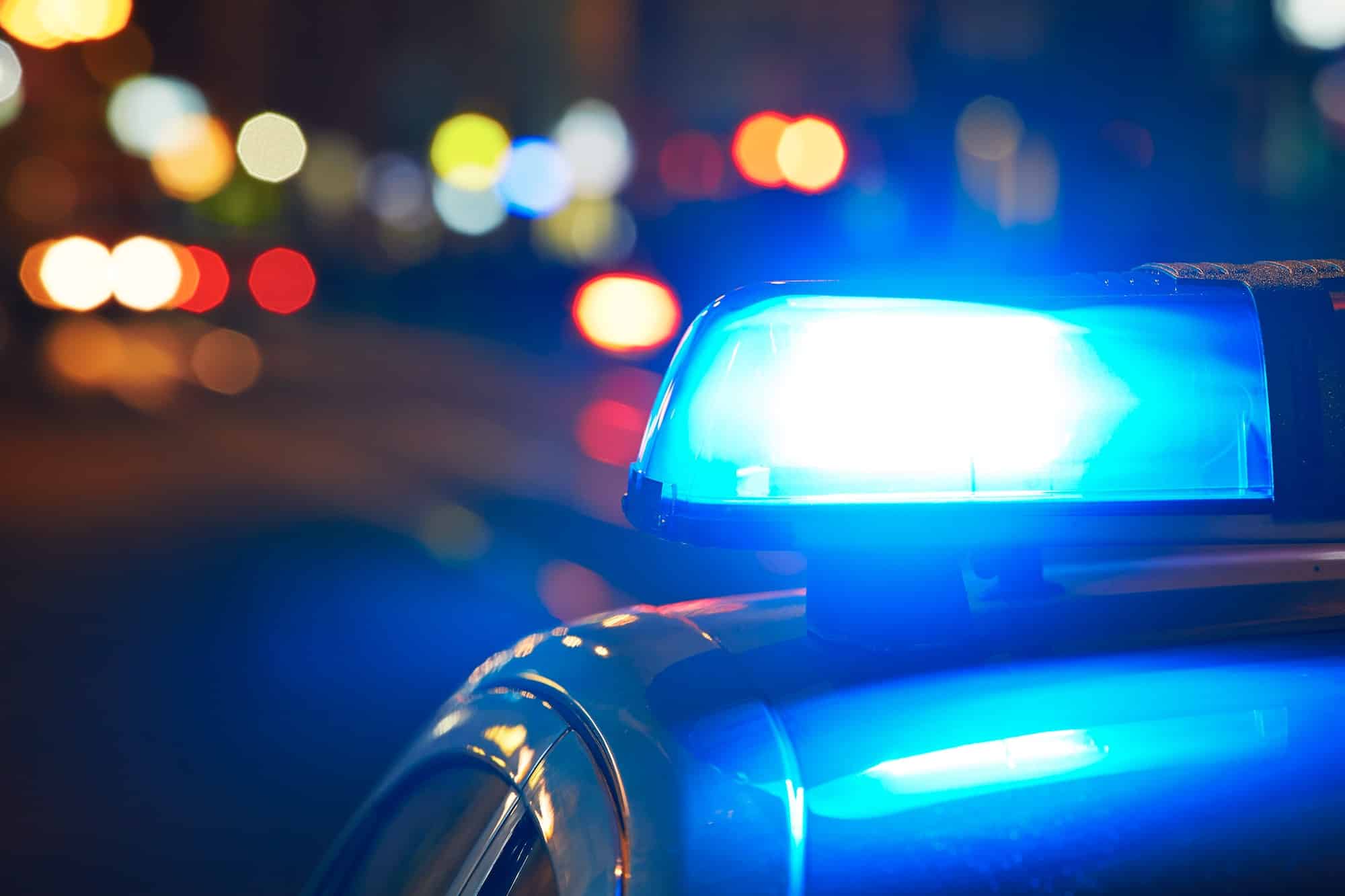 Police car on the street at night