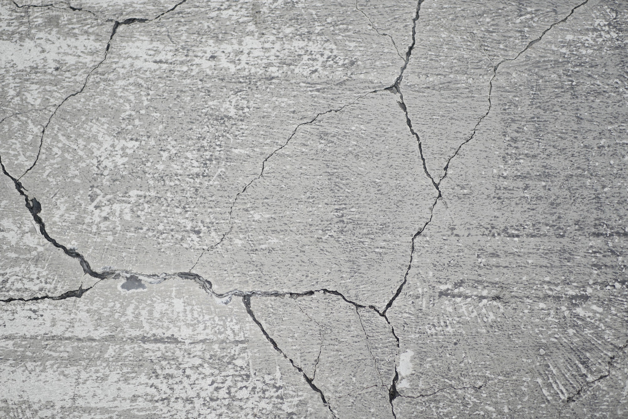 cracked asphalt after earthquake close up