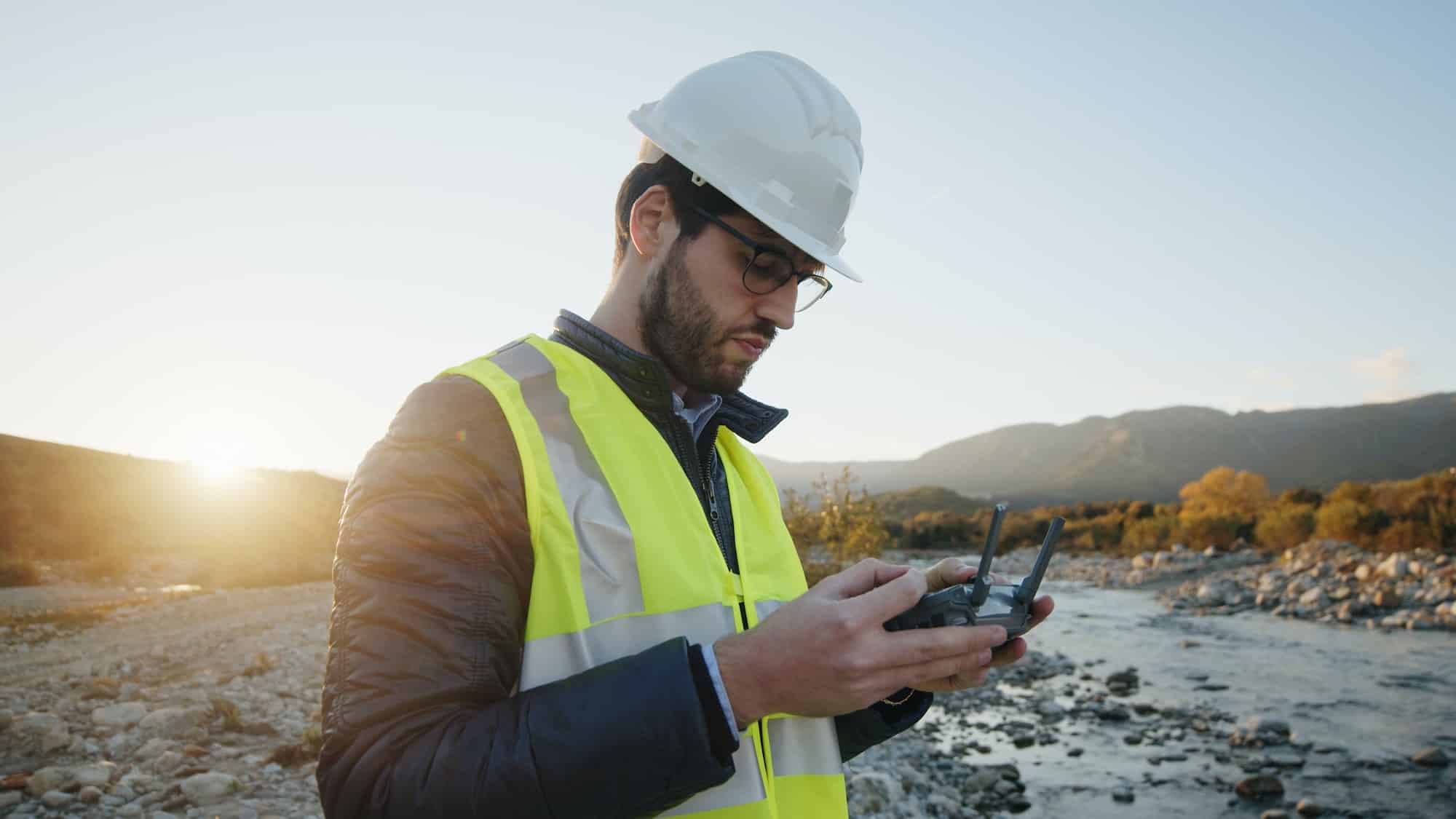 geologist with drone checks the territory