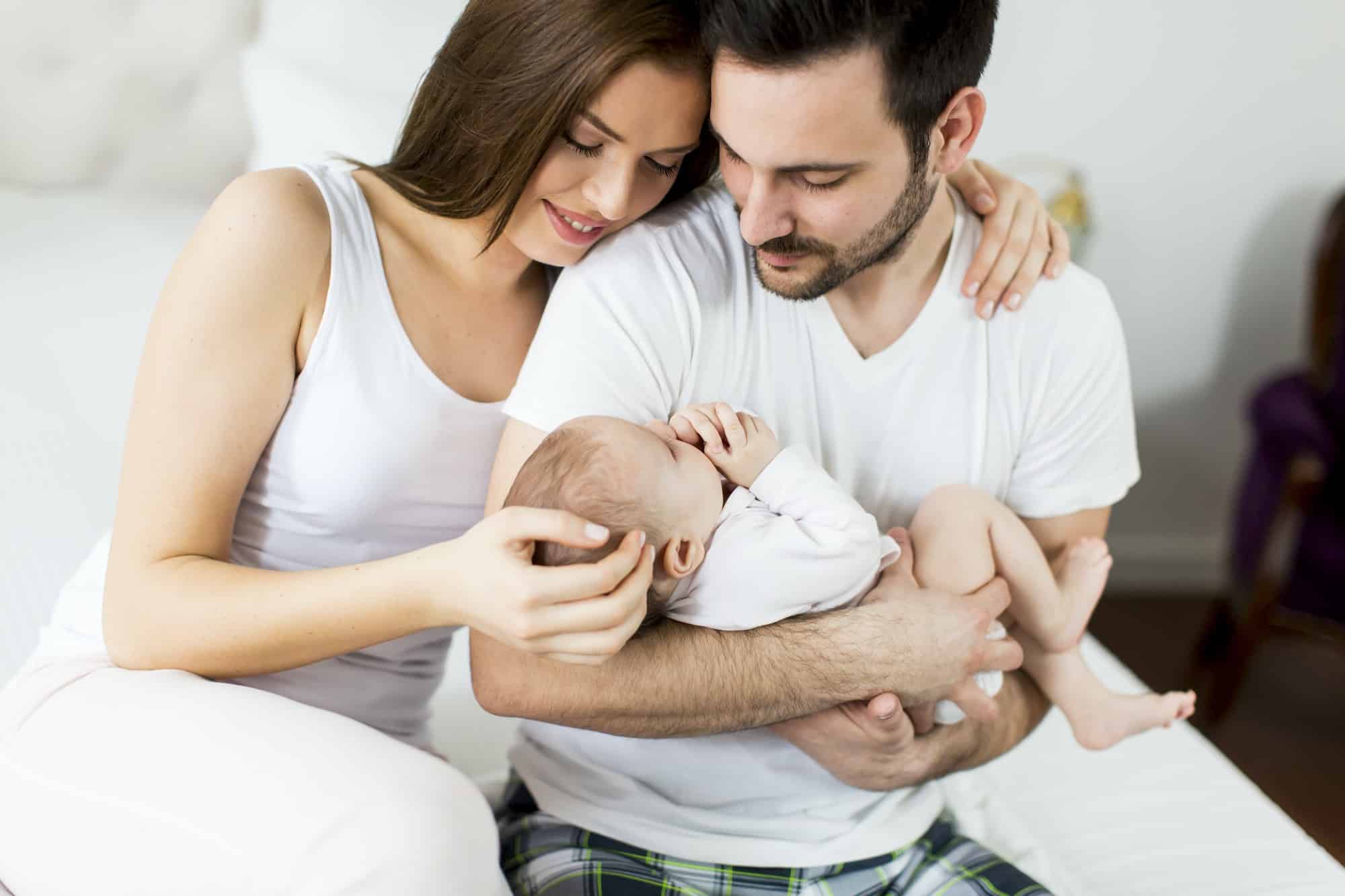 Happy family with newborn baby