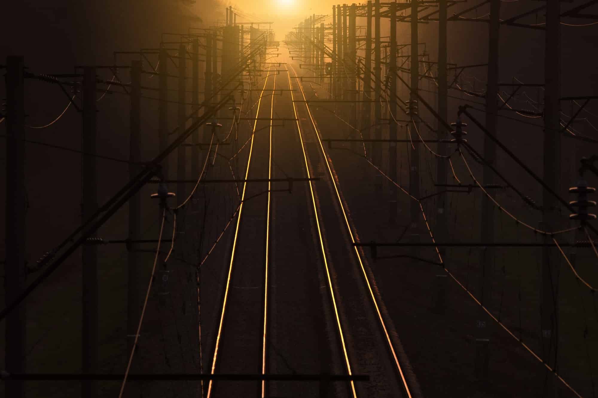 Railroad at sunset. Rail Freight and Passenger Transportation