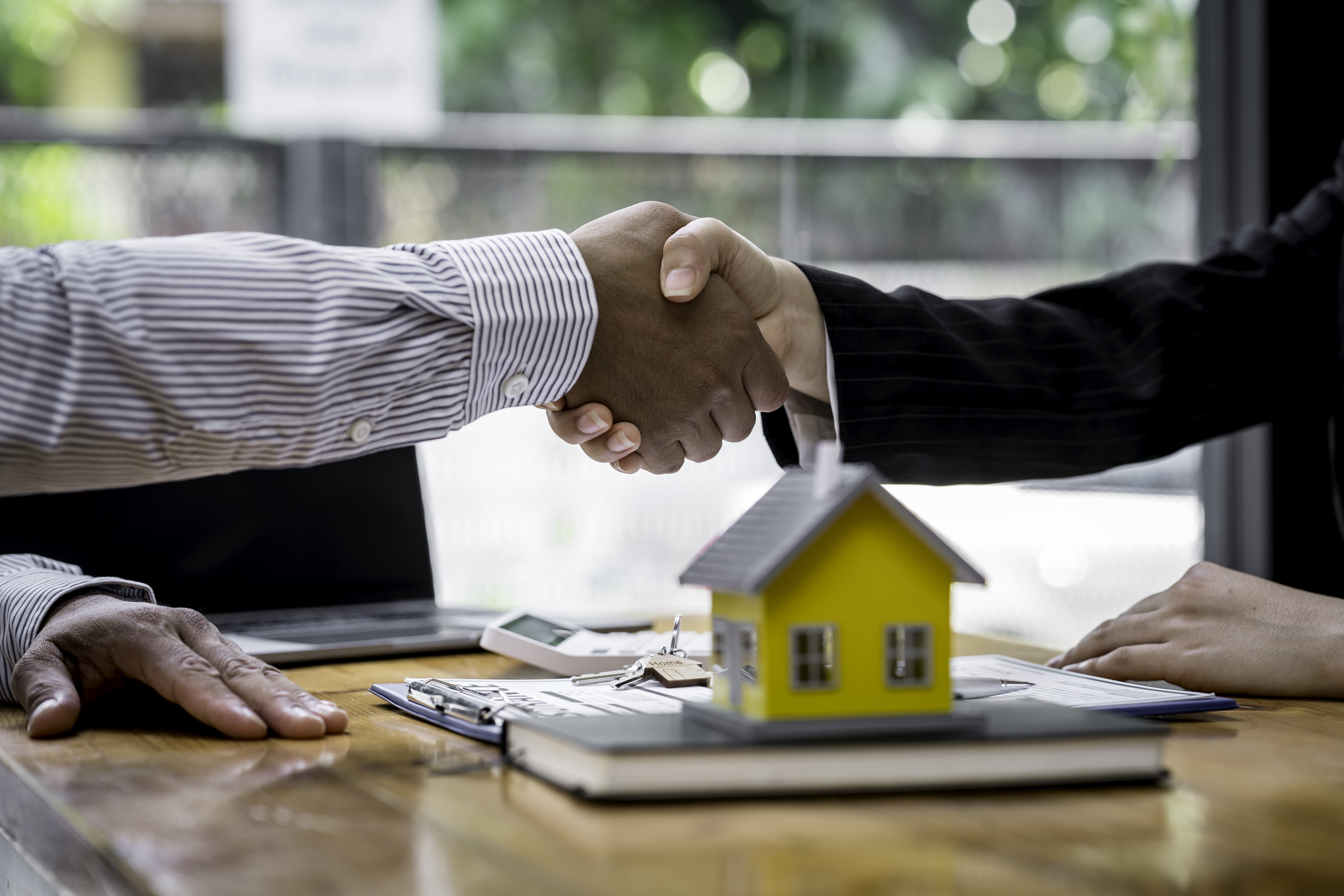 House developers and customer shaking hand after accept agreement finish buying or rental real estat