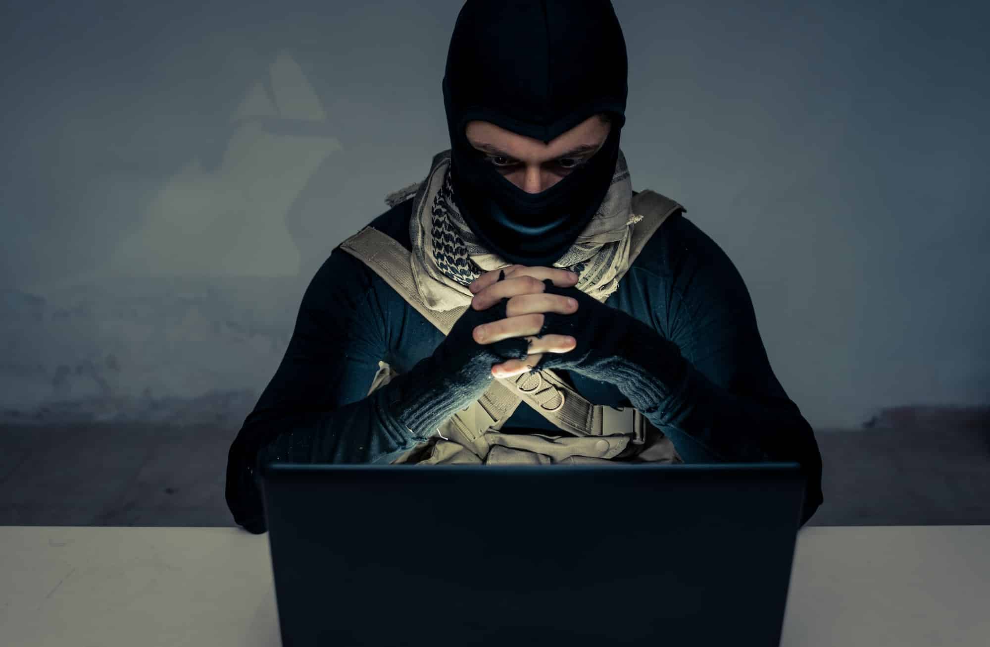 Terrorist working on his computer