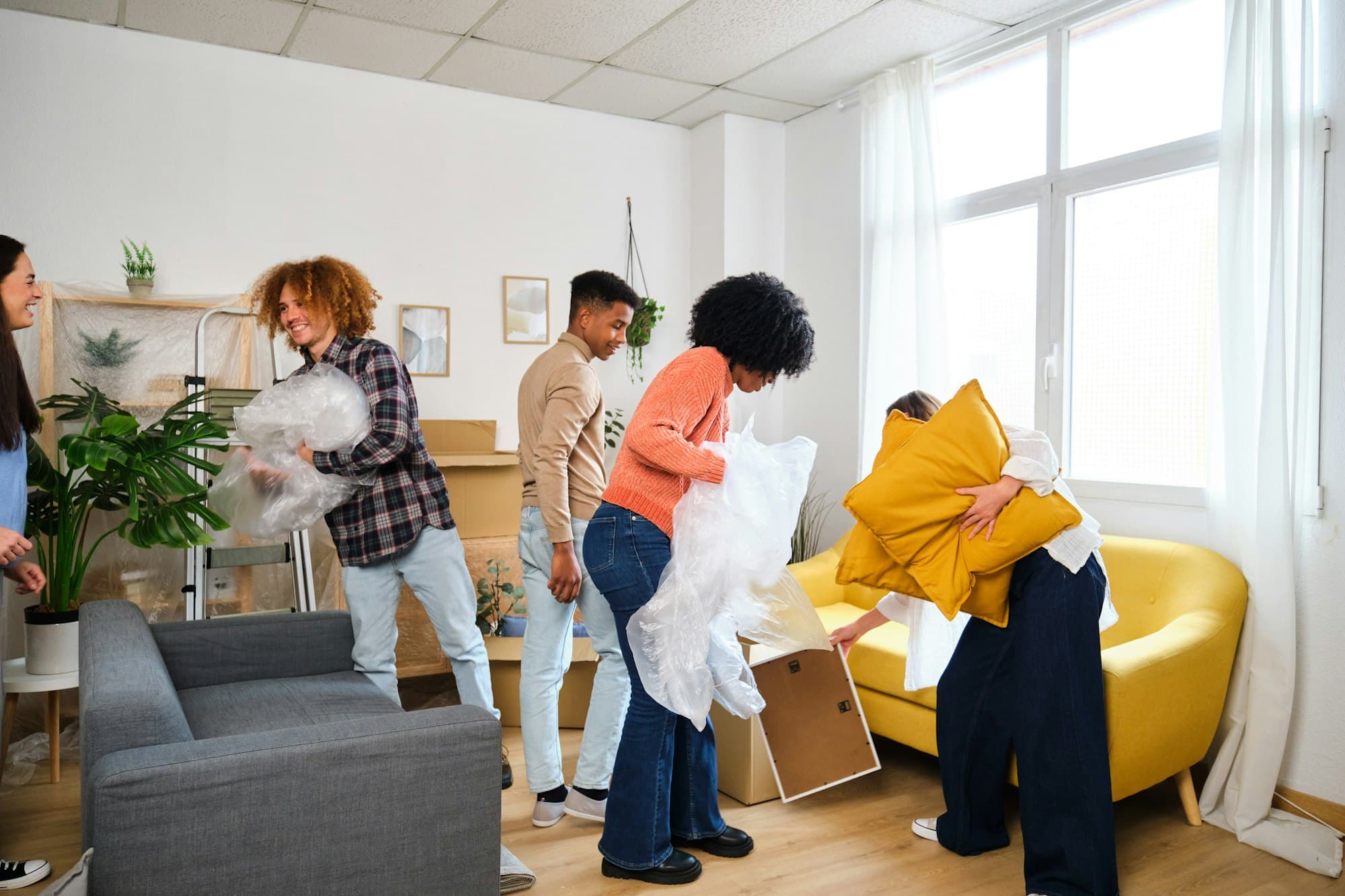 Group of students moving in a student residence at the university.