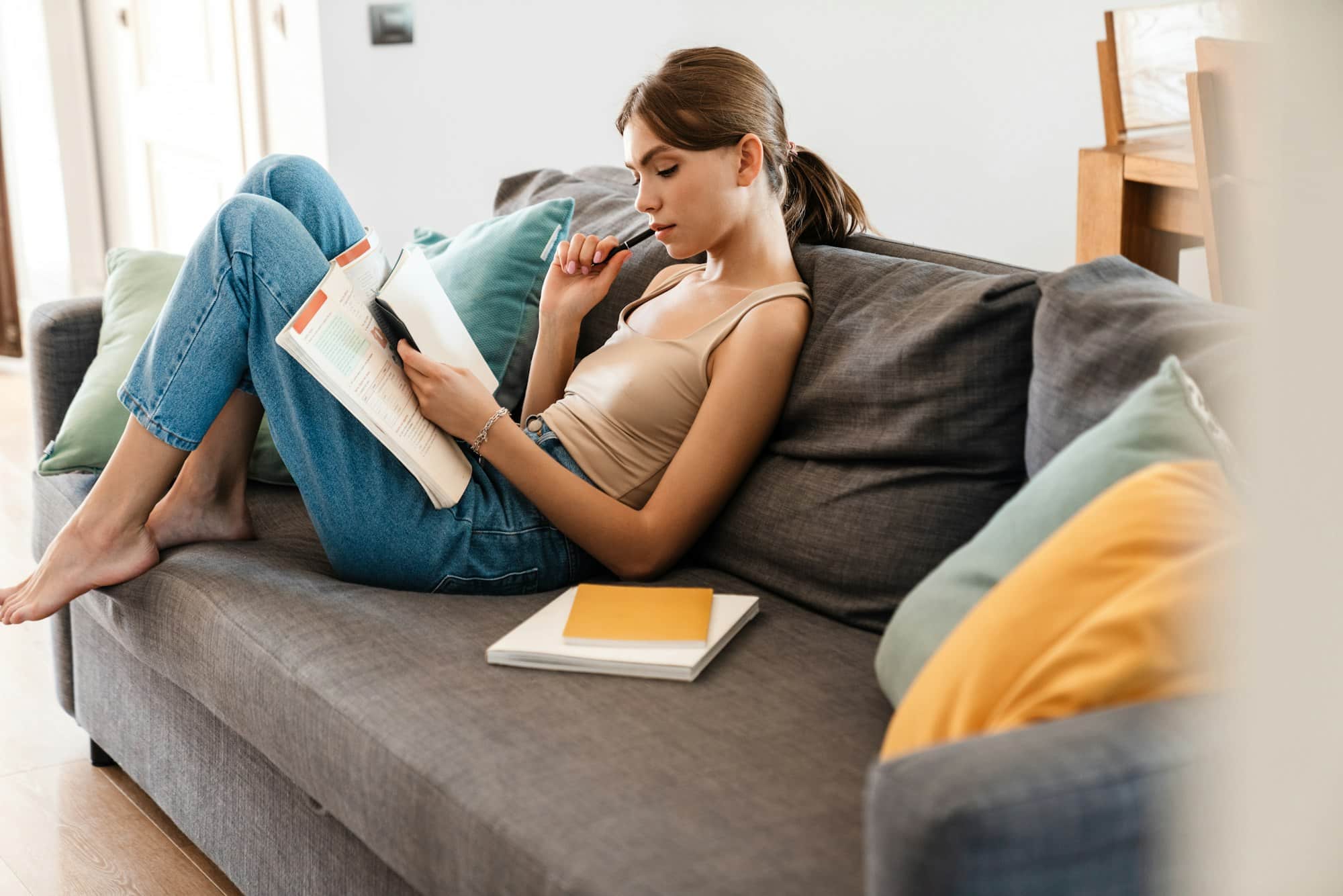 Attractive young woman studying at home