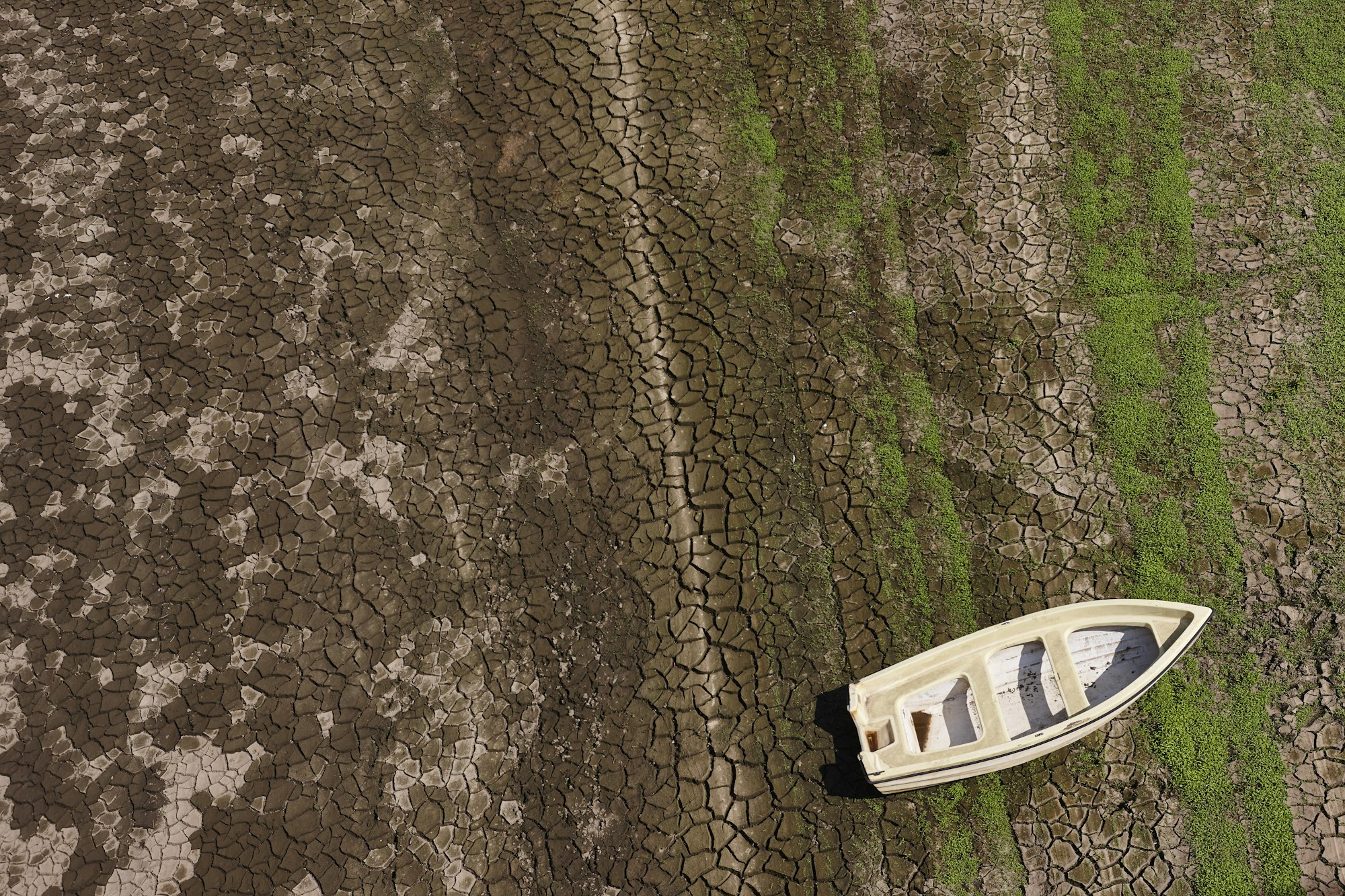 Canoe on a dry river. Drought and global warning. Spain