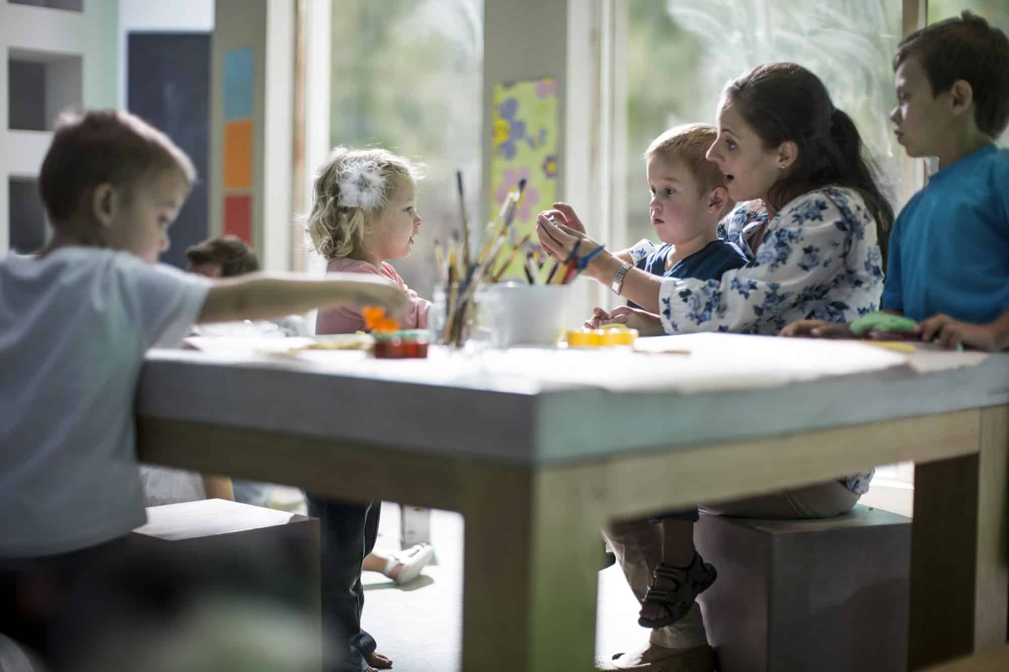 Teacher and children drawing