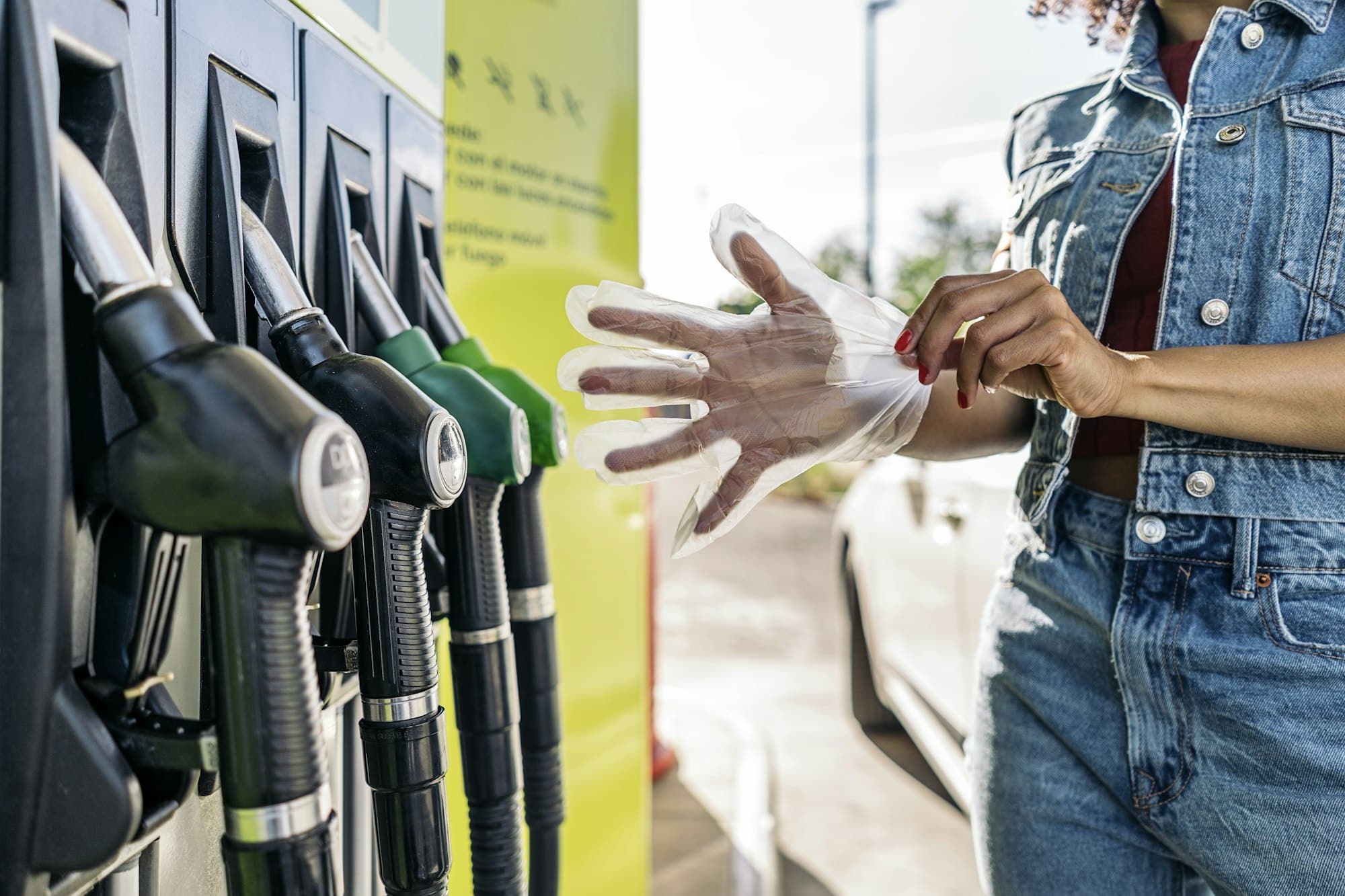 Woman Fueling her Car