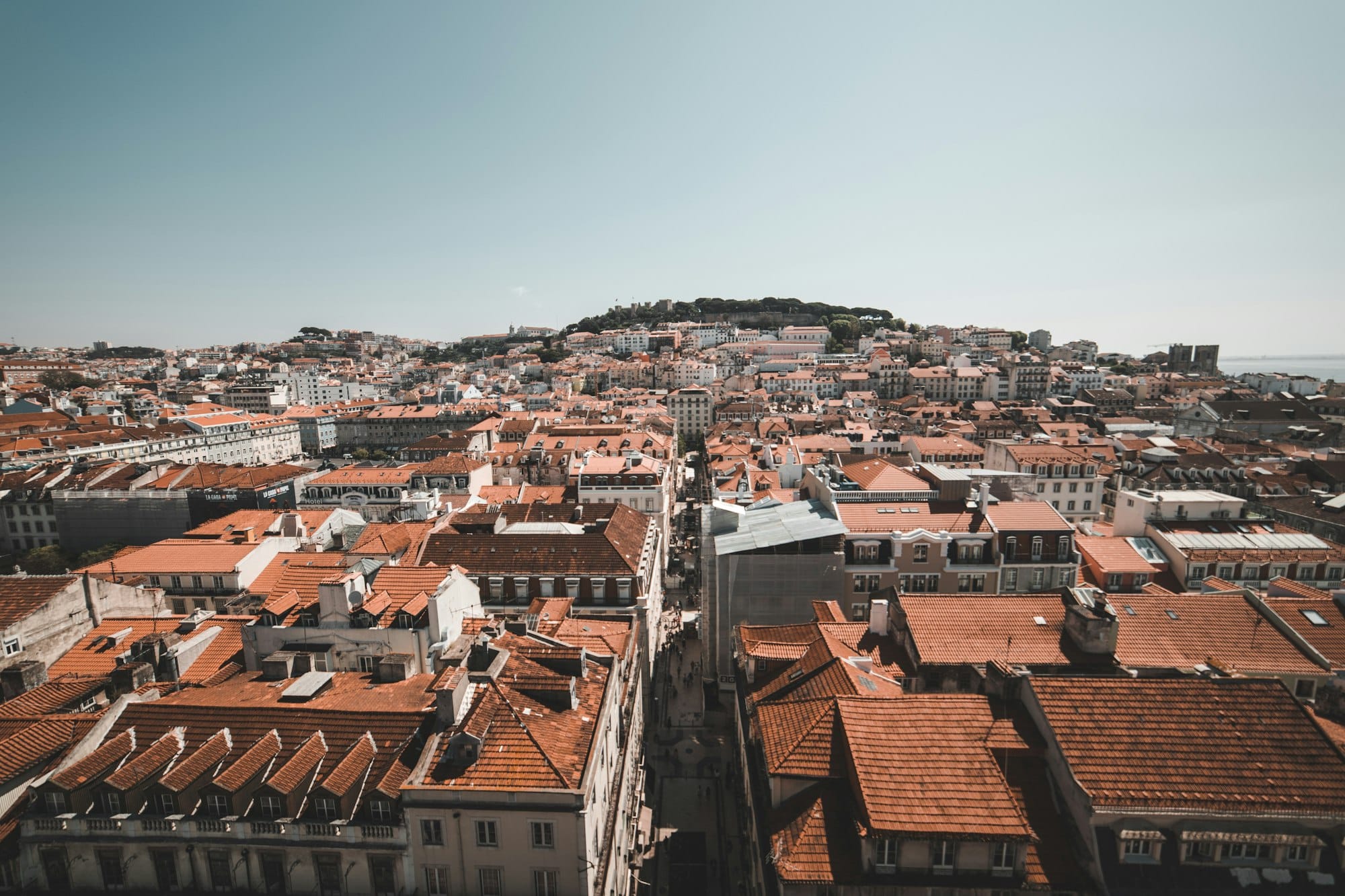 LISBON, PORTUGAL - MAY 7, 2018: town with orange roofs and square in Lisbon, Portugal